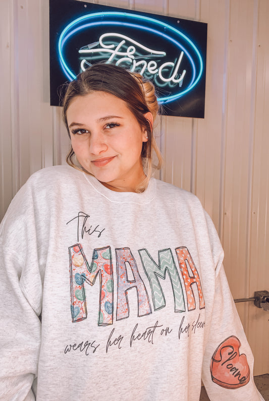 This mama wears her heart on her sleeve w/ sleeve name detail
